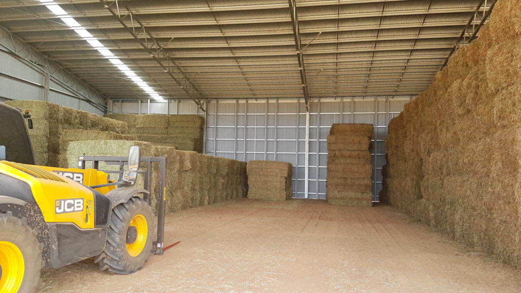 Hay stacked in hay shed