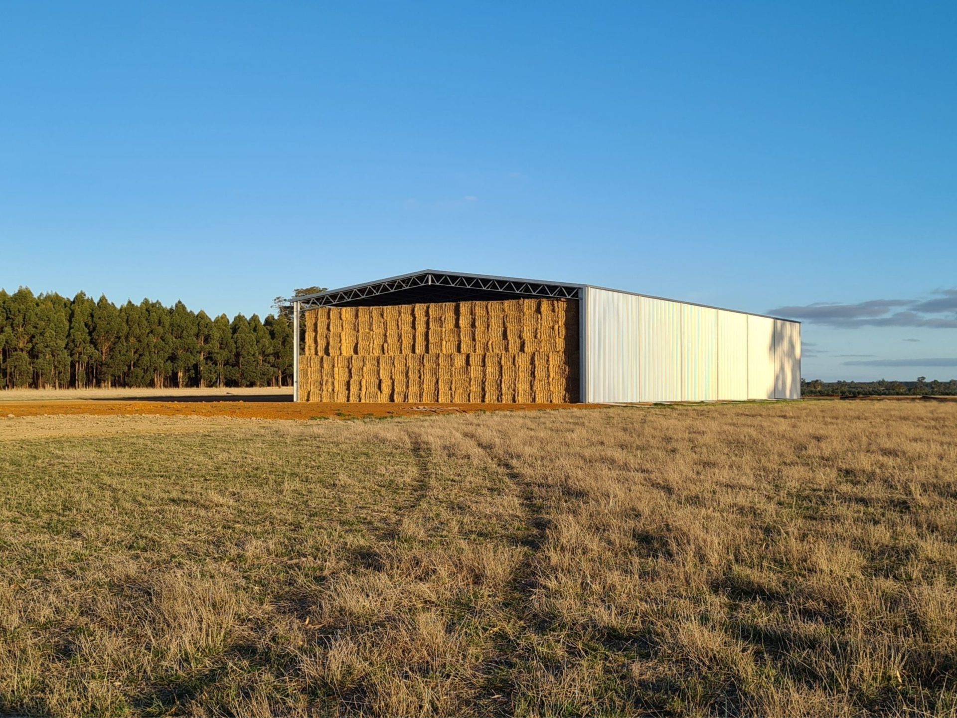 Hay stacked in Action Steel hay shed