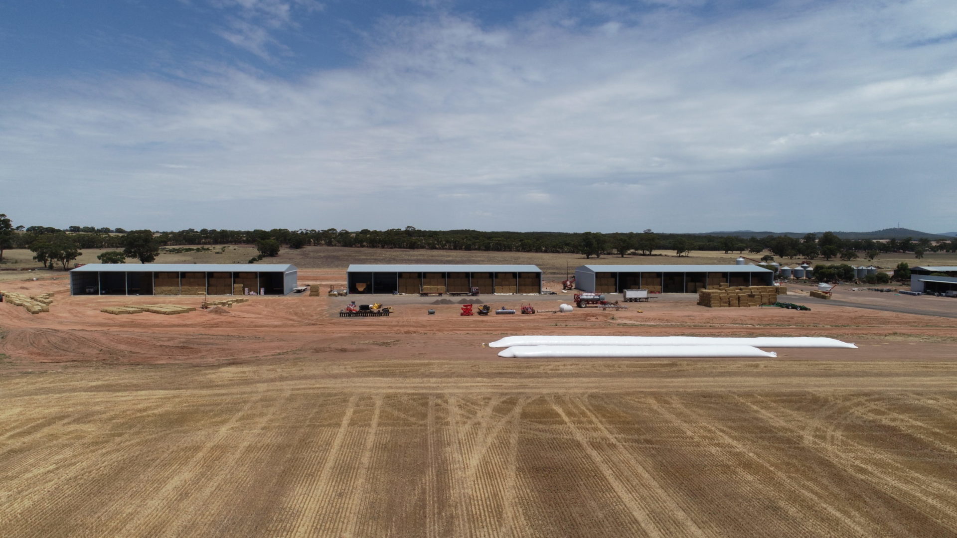 Three 64m x 24m x 7.5m open-front hay sheds