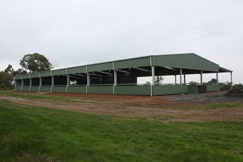 You are currently viewing 21.1m (W) x 61m (L) horse arena with partially enclosed walls for added protection