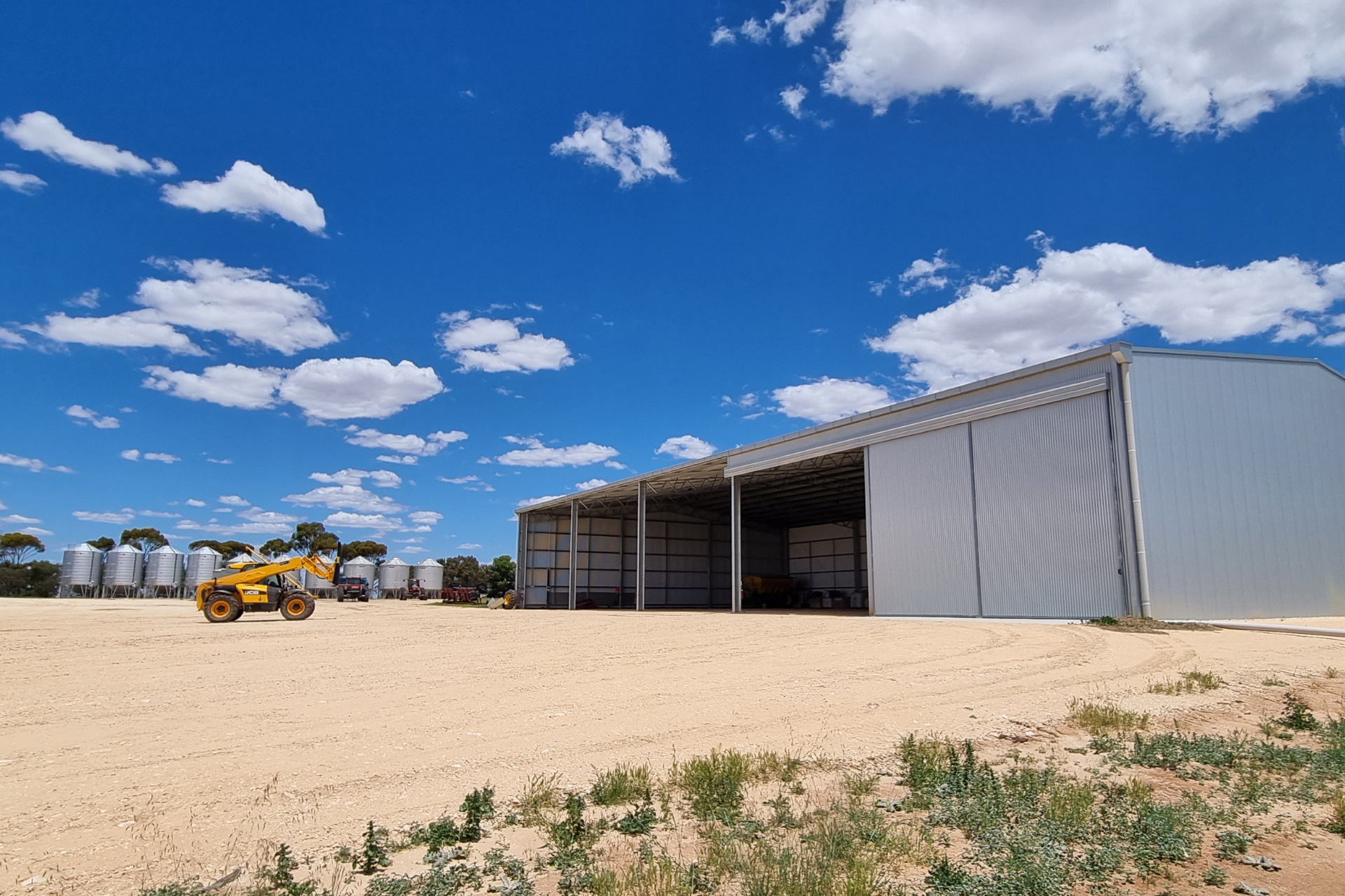 A 45m x 24m machinery shed with one bay enclosed