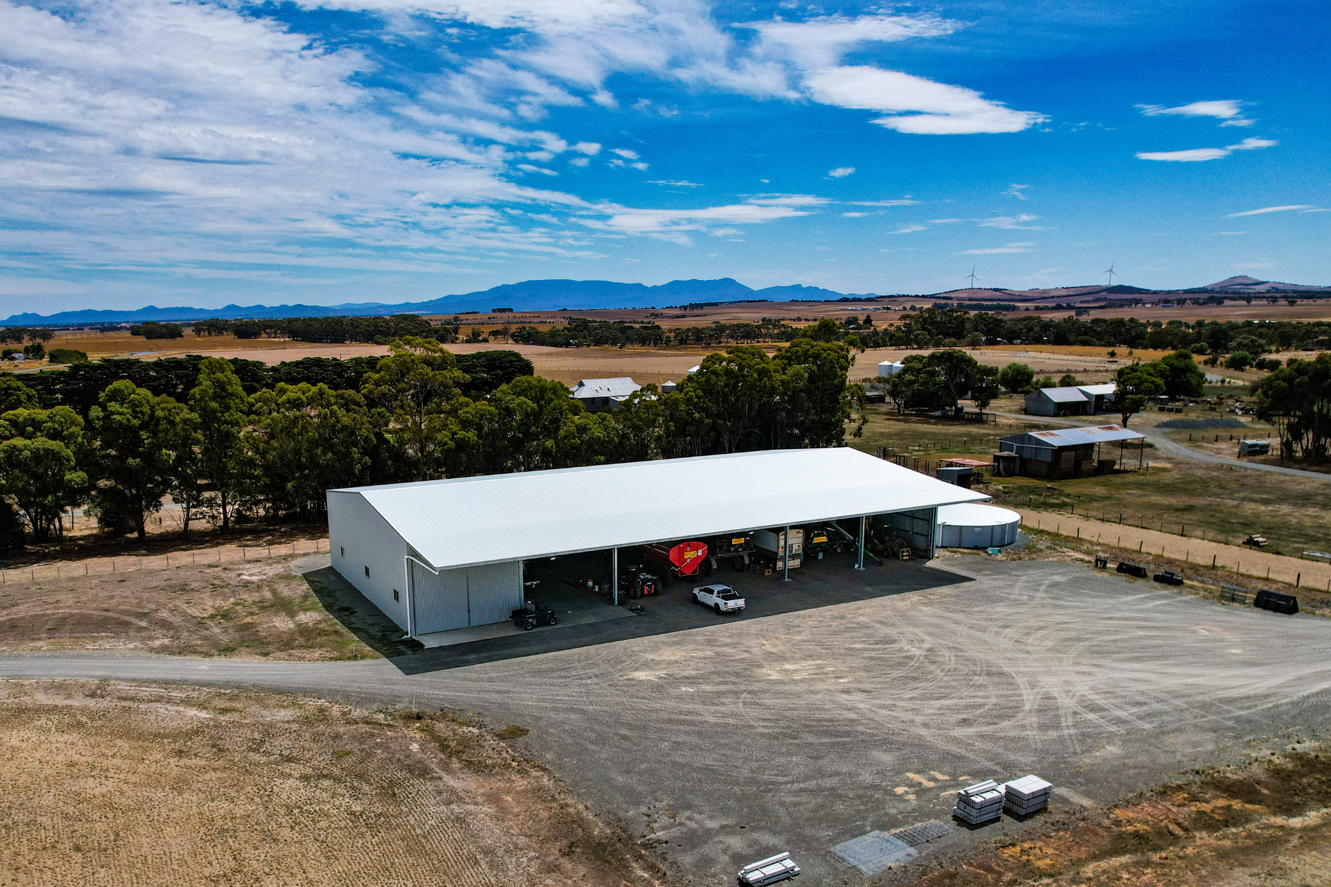 A 48m x 24m x 6.8m machinery shed with 6 metre canopy at Rossbridge VIC