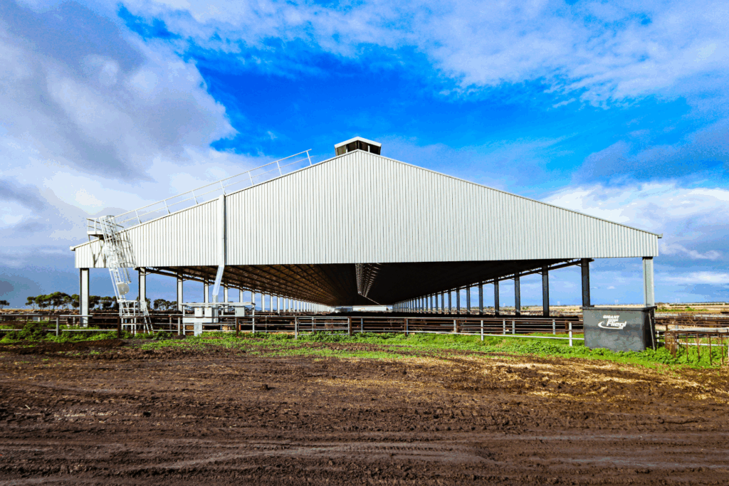 Beef feedlot cover with pop top cover